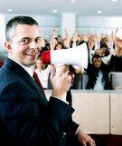 man smiling with bullhorn